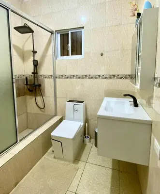 a bathroom with a toilet and a sink and a shower at Casa Tipo Villa, Piscina, Playas De RSJ a 4 min in Río San Juan