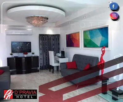 a living room with a couch and a table at Dpravia Hotel SRL in Baní