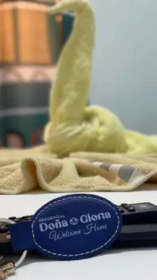 a toy statue of a bird sitting on a towel at Residencial Doña Gloria 2 in San Felipe de Puerto Plata