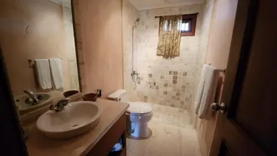 a bathroom with a sink and a toilet at Apartamentos Essential Life con playa y piscina in Punta Cana