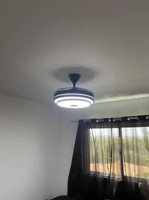 a light on the ceiling of a room with a window at Luxury Penthouse Santo Domingo W in Santo Domingo