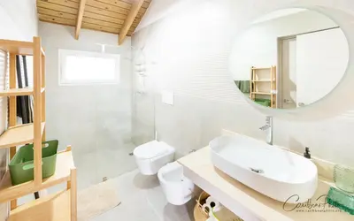 a bathroom with a sink and a mirror at Syrma 302 Estrella Dominicus Apartment in La Laguna