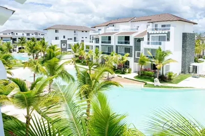 an aerial view of a resort with a pool and palm trees at Syrma 302 Estrella Dominicus Apartment in La Laguna