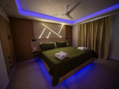 a bedroom with a bed with two towels on it at Garden Condos 5- Luxurious Apartment In Sosua Center in Sosúa