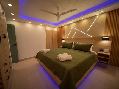 a bedroom with a bed with two towels on it at Garden Condos 5- Luxurious Apartment In Sosua Center in Sosúa