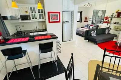 a kitchen and living room with a kitchen and a living room at Residencial Tropimar Sosua in Sosúa