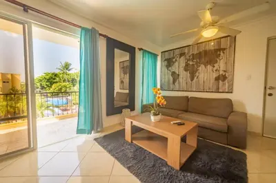 a living room with a couch and a table at Garden Condos Apt 35 - Affordable 1br Apt In Sosua in Sosúa