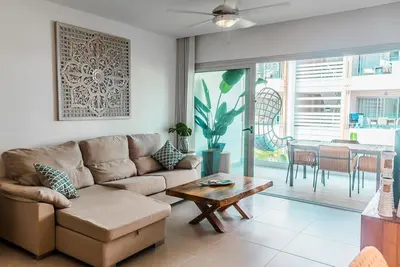 a living room with a couch and a table at Beach Homes Punta Cana in Punta Cana