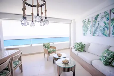 a living room with a couch and a table at Xeliter Las Olas Juan Dolio in Guayacanes
