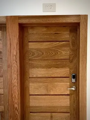 a wooden door with a sign on top of it at Brand New Luxury 1 BDR Pool-Cine - Saune-WIFI - I 19 in Santo Domingo