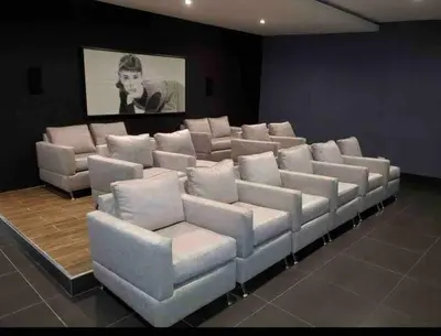 a theater room with white chairs and a painting at Brand New Luxury 1 BDR Pool-Cine - Saune-WIFI - I 19 in Santo Domingo