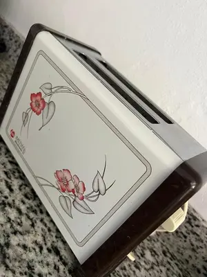 a cell phone with a drawing of flowers on it at alojamiento en san juan de la maguana in SJM