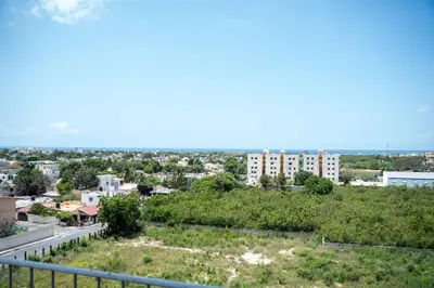 a view of the city from the balcony of a building at Hermoso apartamento con vista al mar y la ciudad in La Romana