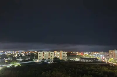a city skyline at night with buildings and lights at Hermoso apartamento con vista al mar y la ciudad in La Romana