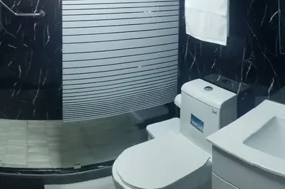 a bathroom with a white toilet and a sink at Desiderio in Santo Domingo
