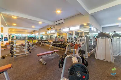 a gym with a lot of equipment in a room at Hotel NEON in Punta Cana
