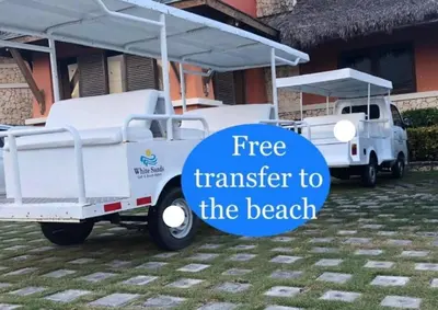 a white golf cart with the text free transfer to the beach at Punta Cana 1-Bed Apt Sleeps 4 with Pool & Hot Tub in Punta Cana