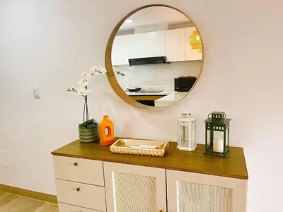 a mirror on top of a dresser in a room at Beauty condo pool views with gym close to the beach in Punta Cana