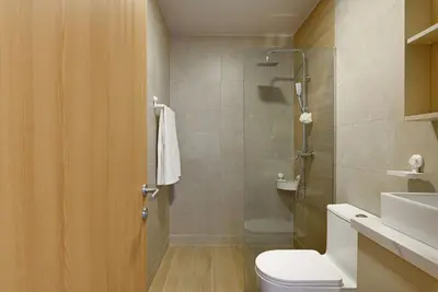 a bathroom with a shower and a toilet and a sink at Beauty condo pool views with gym close to the beach in Punta Cana