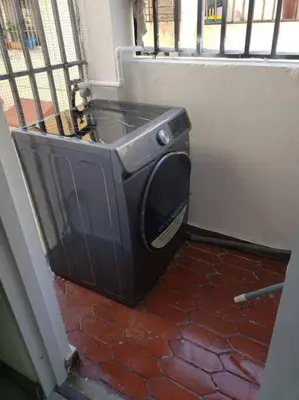 a television sitting in the corner of a room at Los Robles in Santo Domingo