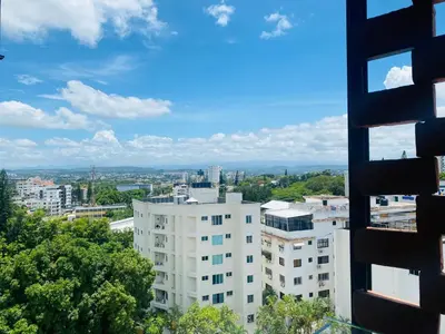 a view of a city from a building at Condo hotel rialto Recidences in Santiago de los Caballeros