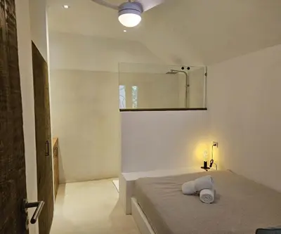 a bedroom with a bed and a mirror on the wall at Soul Dream Bonita in Las Terrenas