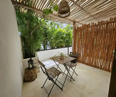 a patio with a table and chairs on a balcony at Soul Dream Bonita in Las Terrenas
