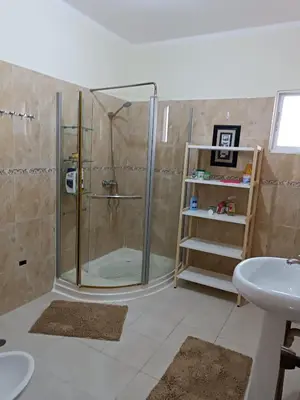 a bathroom with a shower and a sink at TropicalHouse in Punta Cana