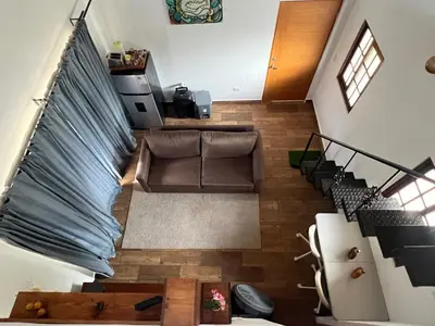 an overhead view of a living room with a couch and stairs at Villa Tierrita in Santa Bárbara de Samaná