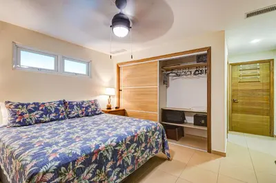 a bedroom with a bed and a walk in closet at Huge Lux 3br Beachfront Condo Wifi Fast in Paraíso