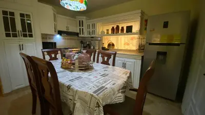 a kitchen with a table with a table cloth on it at Increible Casa Con Piscina! in Los Frailes