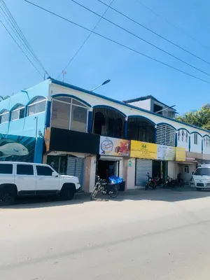 a white truck parked in front of a building at Apartamento Mariela 2 in San Felipe de Puerto Plata