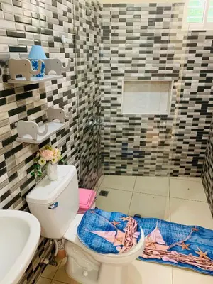 a bathroom with a toilet and a sink at Apartamento Mariela 2 in San Felipe de Puerto Plata