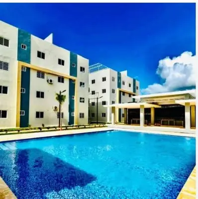 a large swimming pool in front of a building at Disfruta, te lo mereces in La Romana