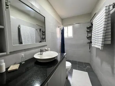 a bathroom with a sink and a toilet and a mirror at Apartamento Estudio Puerto Plata in San Felipe de Puerto Plata