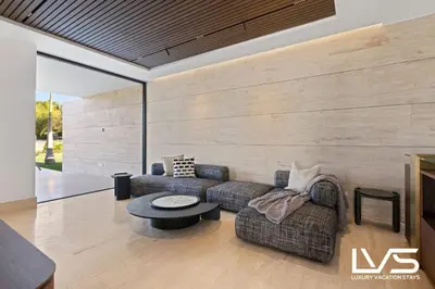 a living room with a couch and a table at Zen Oasis Villa at Casa de Campo in La Romana
