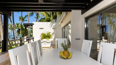 a dining room with a table with a pineapple on it at Aligio Apart-hotel & Spa - Las Terrenas in Las Terrenas