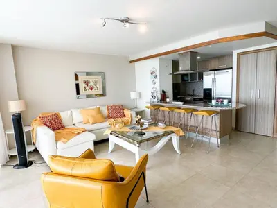 a living room with a couch and a table at Marbella, Juan Dolio, Republica Dominicana in Juan Pedro
