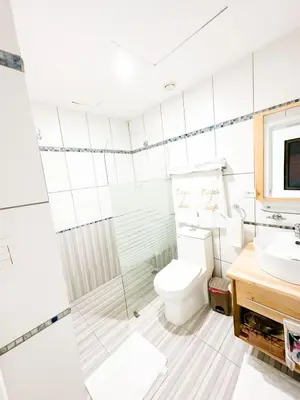 a bathroom with a toilet and a sink at Marbella, Juan Dolio, Republica Dominicana in Juan Pedro