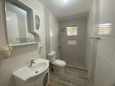 a bathroom with a toilet and a sink and a shower at 6B Santiago Harmonic Apt Especially For You in Santiago de los Caballeros