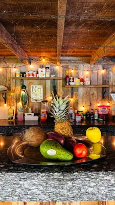 a plate of fruits and vegetables on a counter at Eco Lodges & Camping, Chalets Tropicales, Macao Beach, Bávaro, Punta Cana in Punta Cana