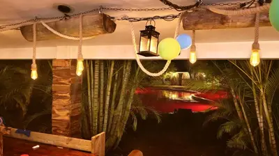 a room with balloons and a light hanging from the ceiling at Eco Lodges & Camping, Chalets Tropicales, Macao Beach, Bávaro, Punta Cana in Punta Cana