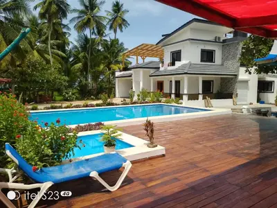 a villa with a swimming pool and a house at Villa Dario in Nagua