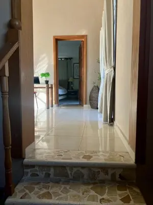a hallway of a house with a door and a room at Palm Suites E-6-two-level apartment with a view of the pool in Punta Cana