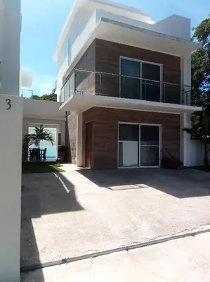 a house with a large driveway in front of it at Ocean Bliss in Sosúa