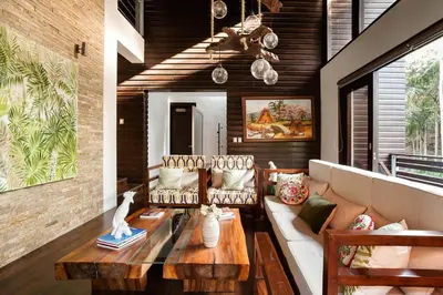 a living room with a couch and a table at Villa de Estilo Japones in Jarabacoa