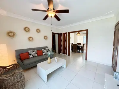 a living room with a couch and a ceiling fan at Tropical apartment 2 Bedroon in Los Corales in Punta Cana