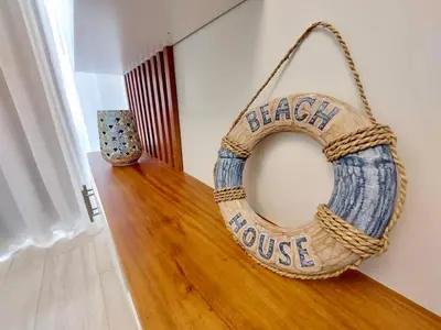 a black house wreath hanging on a wall at Luxury Gateaway Penthouse in front of Hard Rock in Punta Cana