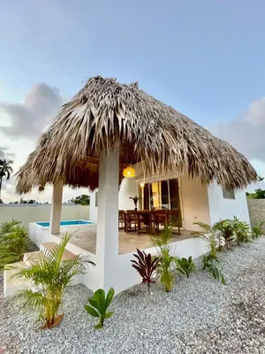 a small house with a thatched roof on the beach at Villa Mar En Dreams House - 4 Pax, 2 Min de La Playa in Las Galeras