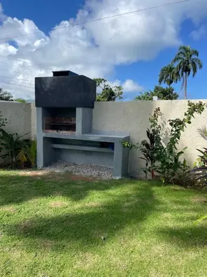 a bench sitting against a wall in a yard at Villa Mar En Dreams House - 4 Pax, 2 Min de La Playa in Las Galeras